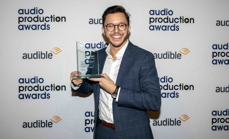 Jassa holding his Best Narrator award